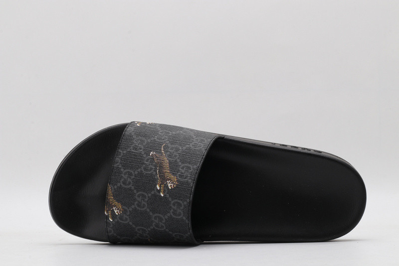 G*u*i slides all black with "tiger"